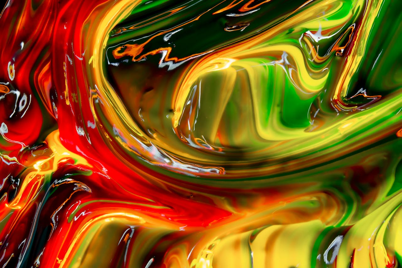Vibrant and fluid abstract paint swirls creating an eye-catching and colorful design.